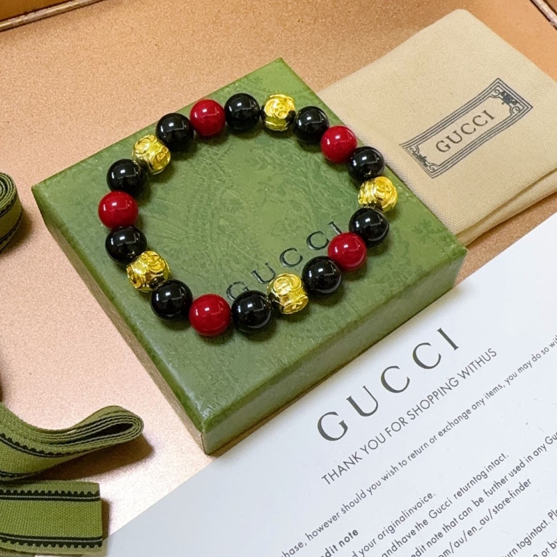 G*u*i bracelets
